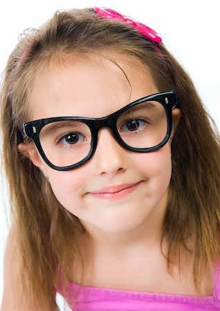 Pretty young girl in glasses against isolated white background Stock Photo - Budget Royalty-Free & Subscription, Code: 400-04876325