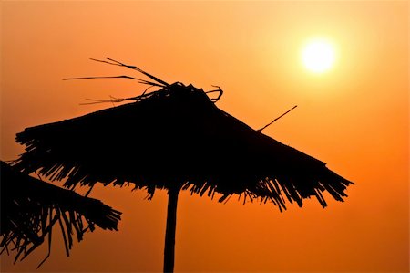 sunset goa - Parasols on sunset, quiet beach holiday in hot season Stock Photo - Budget Royalty-Free & Subscription, Code: 400-04877126