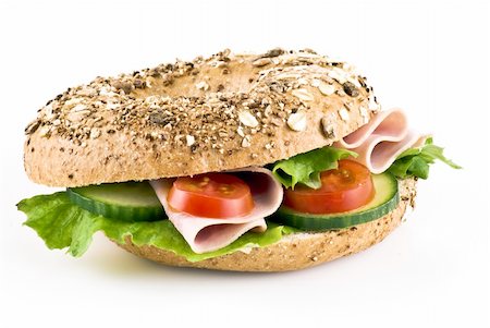 Freshly made sandwich with ham and vegetables over white background Stock Photo - Budget Royalty-Free & Subscription, Code: 400-04877131