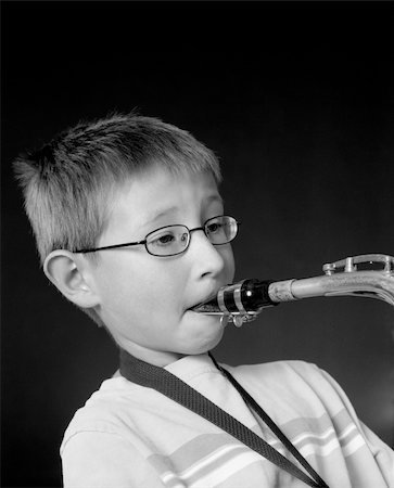 diomedes66 (artist) - Stock Photo: Young Boy playing a saxophone over black Foto de stock - Royalty-Free Super Valor e Assinatura, Número: 400-04877201