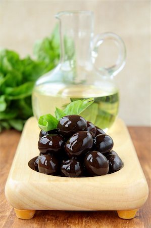 simsearch:400-05666507,k - black olives and a bottle of oil on a wooden stand Stock Photo - Budget Royalty-Free & Subscription, Code: 400-04878465