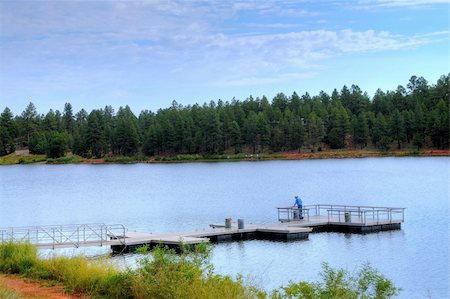 simsearch:400-07035910,k - A man fishing mountain lake from a pier Stock Photo - Budget Royalty-Free & Subscription, Code: 400-04878536