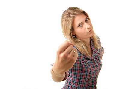 a angry young adult woman threatening with her fist Stock Photo - Budget Royalty-Free & Subscription, Code: 400-04879713