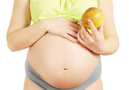 the pregnant married woman holds the apple Stock Photo - Budget Royalty-Free & Subscription, Code: 400-04879769