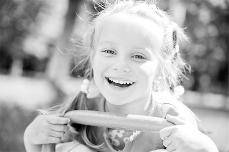 simsearch:400-05342069,k - cute little girl smiling in a park close-up Stock Photo - Budget Royalty-Free & Subscription, Code: 400-04879774