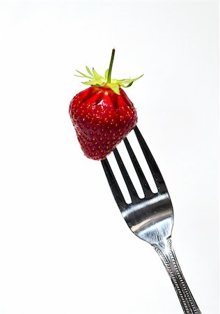 saft - red strawberry on a steel fork on white Stock Photo - Budget Royalty-Free & Subscription, Code: 400-04870001