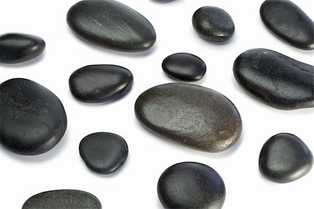 simsearch:400-04640528,k - Spaced out pebbles lying on a white background Stock Photo - Budget Royalty-Free & Subscription, Code: 400-04870134