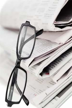 simsearch:400-08613337,k - Newspapers and black glasses on a white a background Stock Photo - Budget Royalty-Free & Subscription, Code: 400-04870235