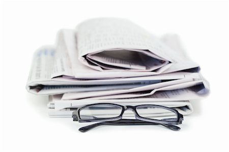 simsearch:400-07774296,k - Newspapers and black glasses on a white a background Stockbilder - Microstock & Abonnement, Bildnummer: 400-04870237