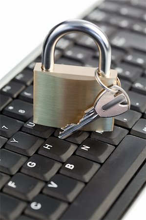 simsearch:400-04359676,k - Padlock standing on a keyboard on a white background Stock Photo - Budget Royalty-Free & Subscription, Code: 400-04870253