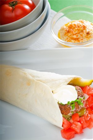 fresh traditional falafel wrap on pita bread with fresh chopped tomatoes Stock Photo - Budget Royalty-Free & Subscription, Code: 400-04870334