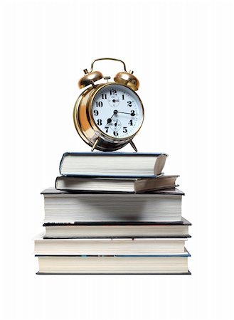 simsearch:700-05974049,k - Alarm clock standing on stack of books. Isolated on white with clipping path Stock Photo - Budget Royalty-Free & Subscription, Code: 400-04870404