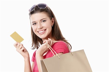 Young girl with a credit card and shopping bags isolated Stock Photo - Budget Royalty-Free & Subscription, Code: 400-04870624