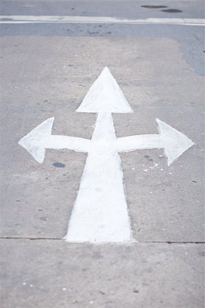 white arrow three head on the road. arrow sign turn left or turn right and goto the way. Stock Photo - Budget Royalty-Free & Subscription, Code: 400-04870828