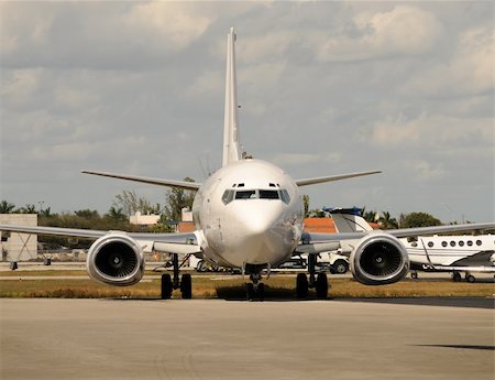 Passenger jet airplane on the ground front view Stock Photo - Budget Royalty-Free & Subscription, Code: 400-04871935