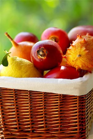 Basket of tropical fruits. Fotografie stock - Microstock e Abbonamento, Codice: 400-04872247