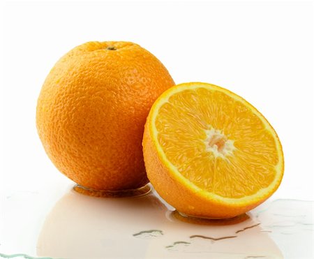 A Fresh juicy oranges isolated on white background. Foto de stock - Super Valor sin royalties y Suscripción, Código: 400-04872934