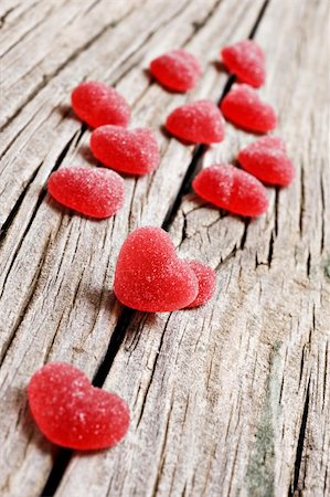 Red heart shaped jelly sweets on a rustic background Stock Photo - Budget Royalty-Free & Subscription, Code: 400-04872990