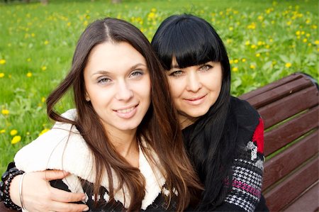 portrait of family on park bench - Portrait of smiling mother and teenage daughter hugging in the park happy Stock Photo - Budget Royalty-Free & Subscription, Code: 400-04873476