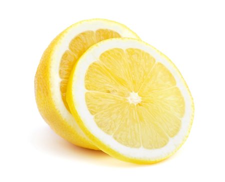 simsearch:400-04994957,k - Half of a lemon with one slice isolated on white background Fotografie stock - Microstock e Abbonamento, Codice: 400-04873536