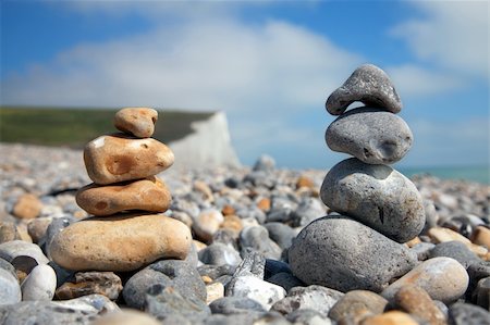 simsearch:625-02927186,k - Two stacks of pebble stones on beach Photographie de stock - Aubaine LD & Abonnement, Code: 400-04873875