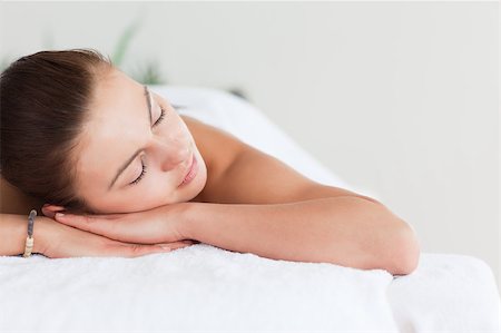 salon background - Close up of a cute brunette lying on a massage table in a spa Stock Photo - Budget Royalty-Free & Subscription, Code: 400-04884138