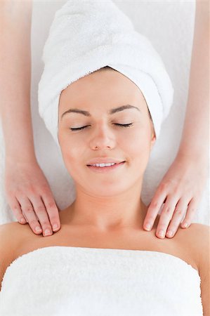 simsearch:400-03951218,k - Happy woman enjoying a shoulder massage against a white background Foto de stock - Royalty-Free Super Valor e Assinatura, Número: 400-04884198