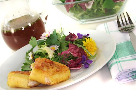 Wild herb salad with goat cheese wrapped in potato on a white background Stock Photo - Budget Royalty-Free & Subscription, Code: 400-04885509