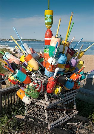 Colorful buoys stacked together on top of a lobster trap Foto de stock - Royalty-Free Super Valor e Assinatura, Número: 400-04885593