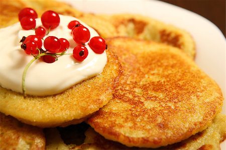 simsearch:400-06066801,k - A picture of traditional Polish potato pancakes with sour cream and redcurrant Stock Photo - Budget Royalty-Free & Subscription, Code: 400-04885682