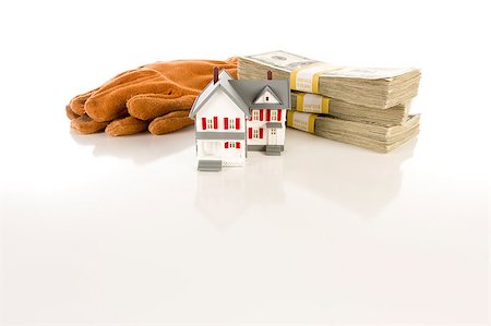 simsearch:400-06770104,k - Stacks of One Hundred Dollar Bills, Leather Work Gloves and Small House on Slight Reflective Surface. Foto de stock - Super Valor sin royalties y Suscripción, Código: 400-04885764