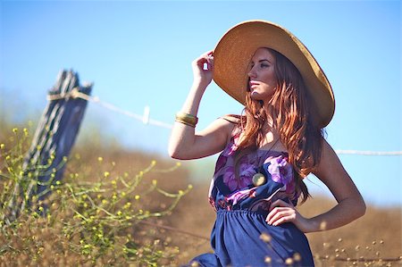 Beautiful Woman in a Field During Summer With Hat Stock Photo - Budget Royalty-Free & Subscription, Code: 400-04886038