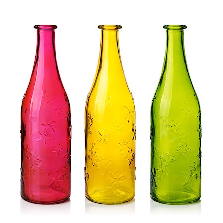 Three empty colorfull glass bottles.  Isolated on white Stock Photo - Budget Royalty-Free & Subscription, Code: 400-04886349