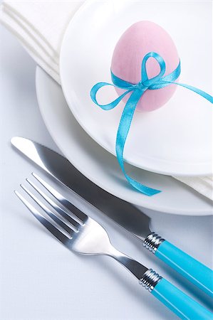 restaurant in blue with table setting - Easter table setting with plates, napkin, silverware and easter egg Stock Photo - Budget Royalty-Free & Subscription, Code: 400-04886695