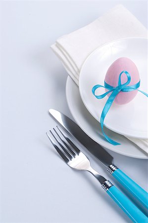 restaurant in blue with table setting - Easter table setting with plates, napkin, silverware and easter egg Stock Photo - Budget Royalty-Free & Subscription, Code: 400-04886696