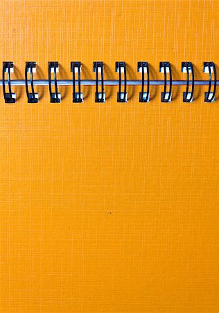 simsearch:400-05367520,k - The cover of the orange notebook, closeup Fotografie stock - Microstock e Abbonamento, Codice: 400-04887212