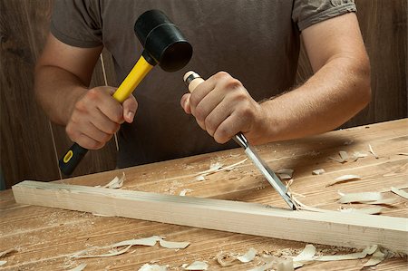 simsearch:600-00551132,k - Wood workshop. Carpenter working with chisel. Photographie de stock - Aubaine LD & Abonnement, Code: 400-04887450