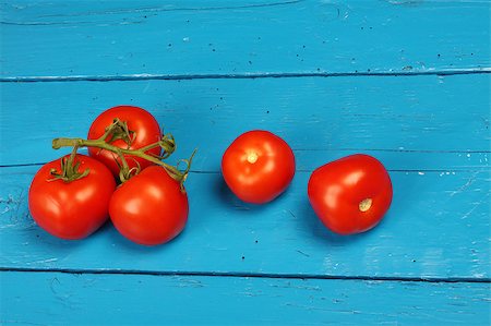 produce wet - Close up of fresh tomatoes  on blue table Stock Photo - Budget Royalty-Free & Subscription, Code: 400-04887489