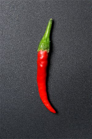 simsearch:400-07211737,k - red hot chilli pepper on black Photographie de stock - Aubaine LD & Abonnement, Code: 400-04887646