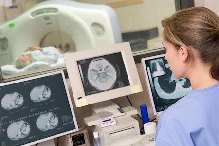 Nurse Monitoring Patient Having A Computerized Axial Tomography (CAT) Scan Stock Photo - Budget Royalty-Free & Subscription, Code: 400-04887862