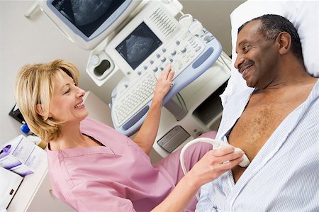 simsearch:400-04887902,k - Nurse Giving Patient An Ultra Sound Stock Photo - Budget Royalty-Free & Subscription, Code: 400-04887885