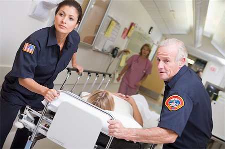 simsearch:400-04887902,k - Paramedics Rushing Emergency Patient Into Hospital Stock Photo - Budget Royalty-Free & Subscription, Code: 400-04887906