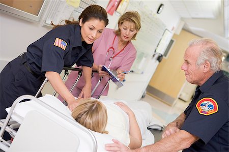 simsearch:400-04887902,k - Paramedics Rushing Emergency Patient Into Hospital Stock Photo - Budget Royalty-Free & Subscription, Code: 400-04887907