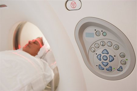 doctor with ct scan - Patient Having A Computerized Axial Tomography (CAT) Scan Stock Photo - Budget Royalty-Free & Subscription, Code: 400-04887987