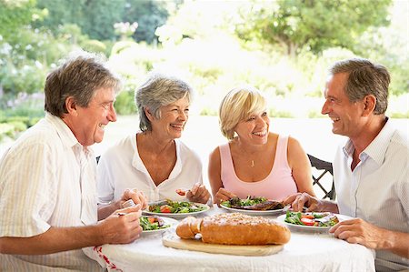 Friends Eating An Al Fresco Lunch Stock Photo - Budget Royalty-Free & Subscription, Code: 400-04888034