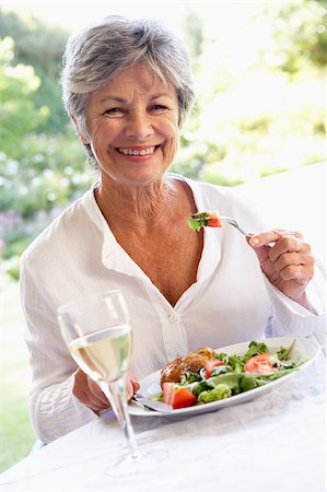 senior woman and wine and one person - Senior Woman Eating An Al Fresco Lunch Stock Photo - Budget Royalty-Free & Subscription, Code: 400-04888048