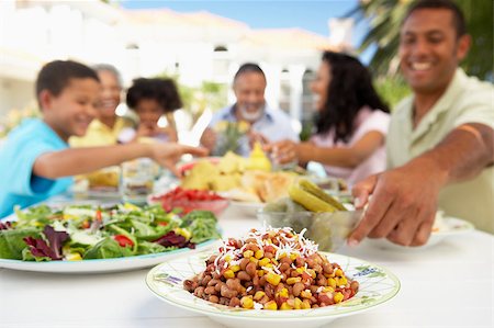 Family Eating An Al Fresco Meal Stock Photo - Budget Royalty-Free & Subscription, Code: 400-04888057