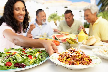 Family Eating An Al Fresco Meal Stock Photo - Budget Royalty-Free & Subscription, Code: 400-04888064