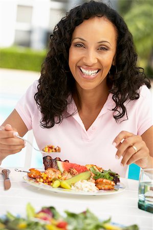 Middle Aged Woman Dining Al Fresco Stock Photo - Budget Royalty-Free & Subscription, Code: 400-04888071