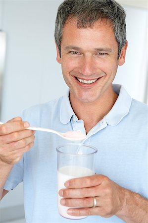 Middle Aged Man Holding Dietary Supplements Stockbilder - Microstock & Abonnement, Bildnummer: 400-04888281